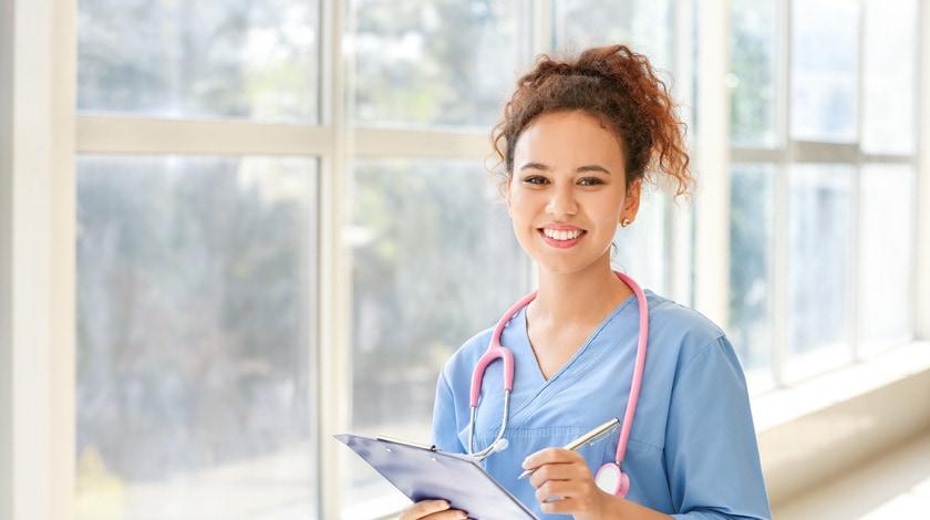 High school nursing program student in scrubs